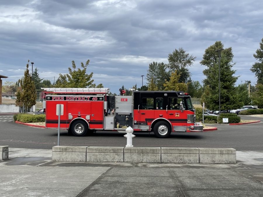Renton Regional Fire Engine 317 departs after finding an illegal discharged fire extinguisher in the boys gym bathroom Wednesday.