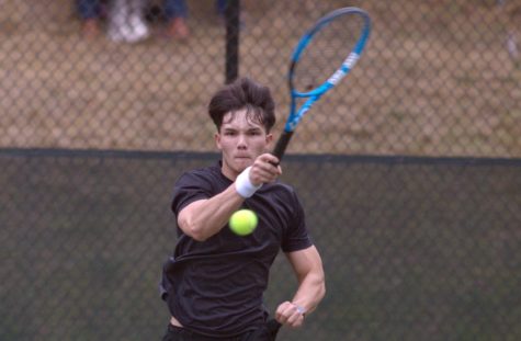 Gene Bushaw returns a serve Tuesday to beat Highlines Daclo Colcic 6-2, 6-1 in the season opener.
