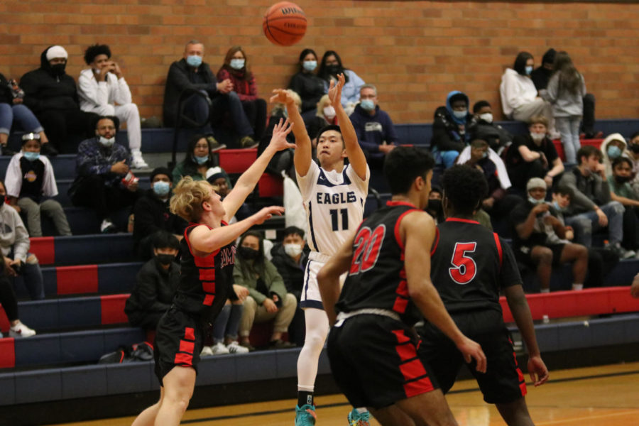 Ryan Do shoots a three pointer against Sammamish earlier in the season.