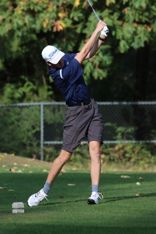 Soren Bostrom tees off on the fifth hold of Maplewood Golf Course Thursday. He shot a 44. 